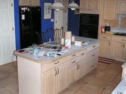 kitchen with island and tiled floors