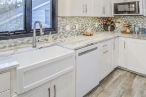 kitchen with granite countertop and tiled backsplash